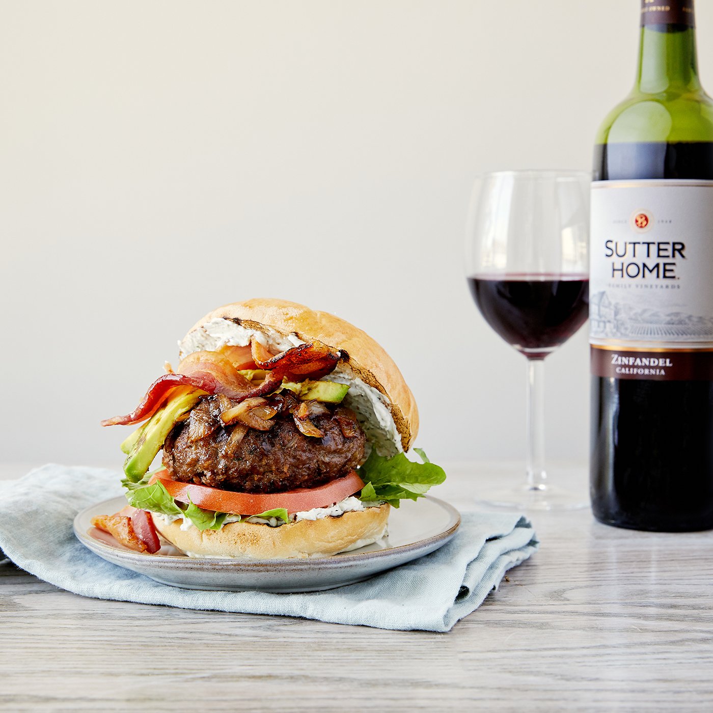 Grilled California Avocado BLT Burgers with Carmelized Onions