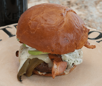 Latino Pork Burgers with Roasted Anaheim Chiles, Lime Cilantro Mayonnaise, Smoked Bacon, and Monterey Pepper Jack Cheese