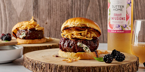 Goat Cheese & Basil Stuffed Burger With Blackberry Cabernet BBQ Sauce & Crispy Onion Strings