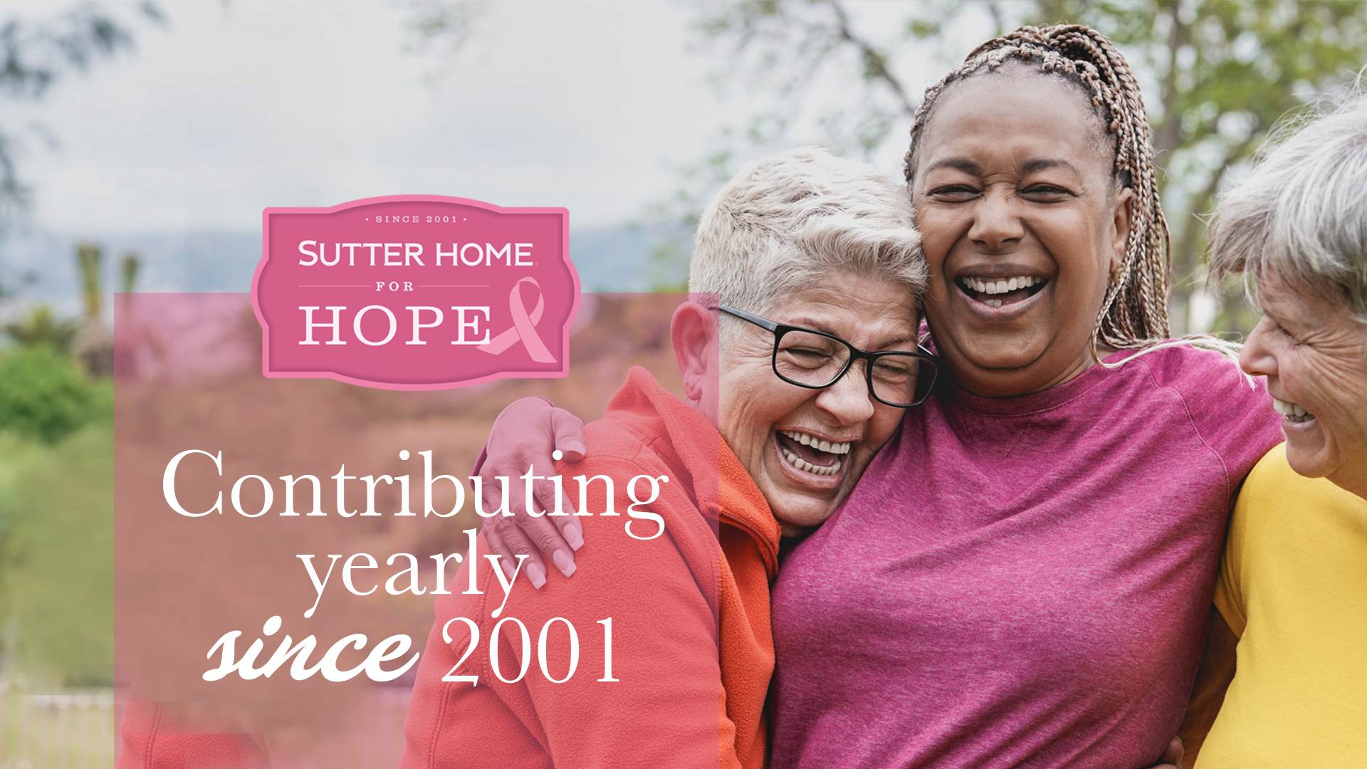 Group of diverse women smiling, holding flowers, and wearing pink, representing unity and hope - Sutter Home for Hope campaign image