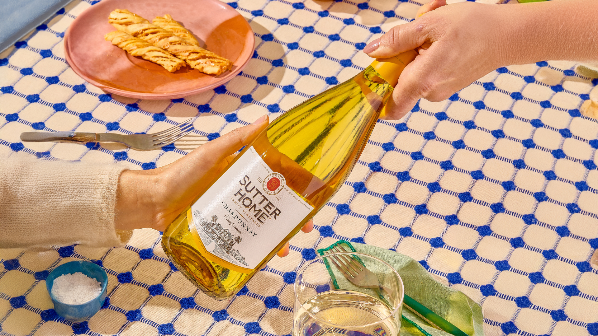 Sutter Home Chardonnay being shared across a table