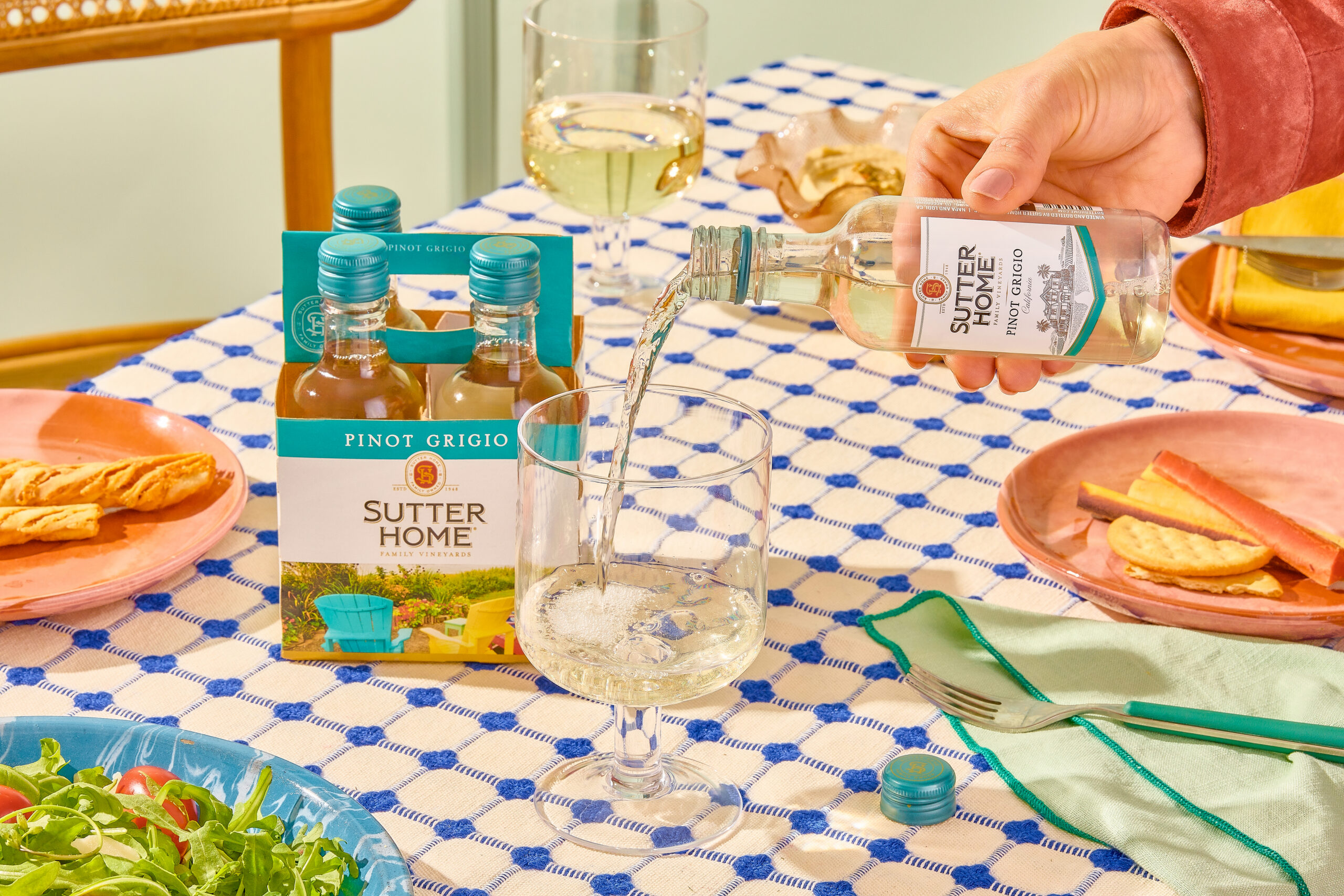 Sutter Home Chardonnay being shared across a table
