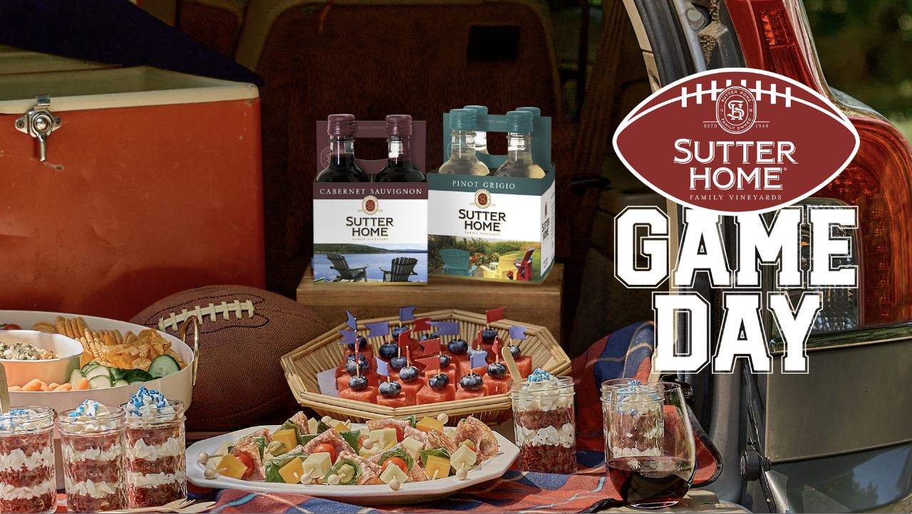A table top scene of sports items including a football, bowls of chips and snacks, hors d'oeuvres, a cooler, packs of Sutter Home mini bottles, with a Game Day logo overlay 